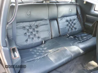 1988 Cadillac Eldorado z VIN 1G6EL1155JU600524, wystawiony jako Copart lot #59505125 z przebiegiem 110 972 mil mil oraz Szkoda całkowita • Salvage title. Historia ofert i sprzedaży dostępna na DreamBid. Obrazek 10.