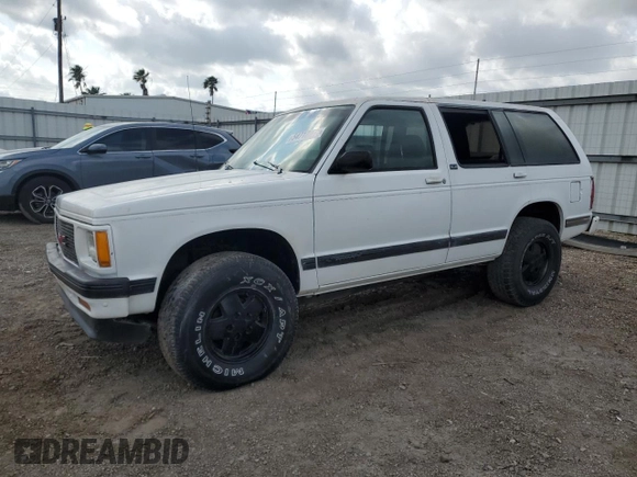 1994 GMC Jimmy Diamond Edition Luxury z VIN 1GKDT13W5R2503916, wystawiony jako Copart lot #54717215 z przebiegiem 99 991 mil mil oraz Szkoda całkowita • Salvage title. Historia ofert i sprzedaży dostępna na DreamBid. Obrazek 1.