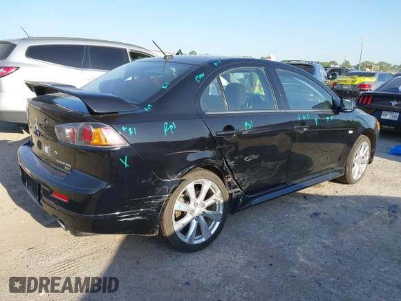 2014 Mitsubishi Lancer Ralliart with VIN JA32V6FVXEU005172, listed as a IAAI auction lot 41983895 with 70,584 mi miles and . Bid and sale history available at DreamBid. Image 4.