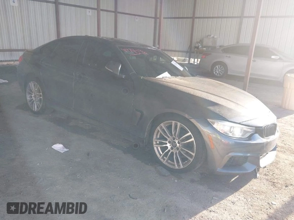 2015 BMW 4 Series 428i with VIN WBA4A5C54FG051307, listed as a IAAI auction lot 41774596 with 126,852 mi miles and . Bid and sale history available at carsss.com. Image 1.