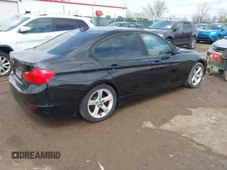 2014 BMW 3 Series 328i xDrive with VIN WBA3B3C58EJ982424, listed as a IAAI auction lot 42075568 with 190,009 mi miles. Bid and sale history available at carsss.com. Image 4.