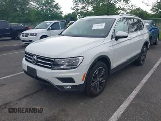 2018 Volkswagen Tiguan SEL with VIN 3VV2B7AX4JM012840, listed as a IAAI auction lot 42263511 with 105,510 mi miles and . Bid and sale history available at DreamBid. Image 2.