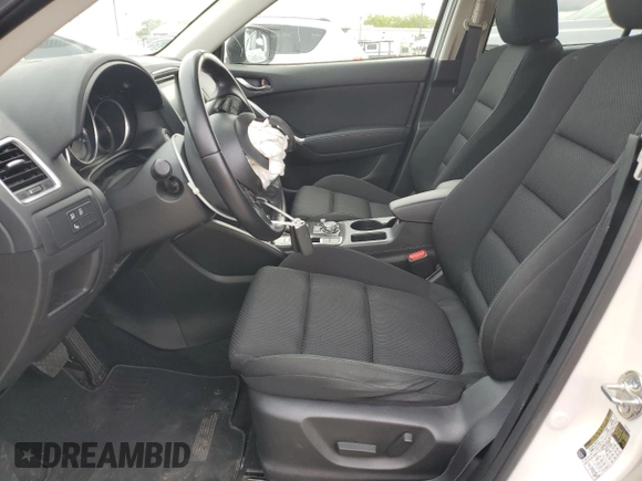 2016 Mazda CX-5 Touring with VIN JM3KE2CYXG0777715, listed as a Copart auction lot 52157005 with 58,585 mi miles and Salvage Title. Bid and sale history available at carsss.com. Image 7.
