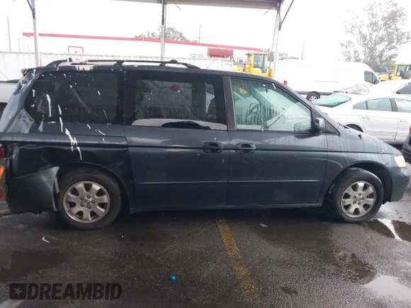 2004 Honda Odyssey EX-L with VIN 5FNRL18974B015769, listed as a IAAI auction lot 41533063 with 284,923 mi miles and . Bid and sale history available at DreamBid. Image 13.