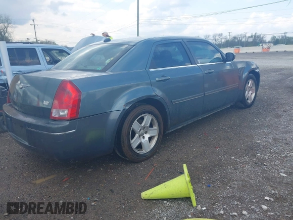 2005 Chrysler 300 with VIN 2C3AA53G55H186617, listed as a IAAI auction lot 42004943 with 230,956 mi miles. Bid and sale history available at carsss.com. Image 4.