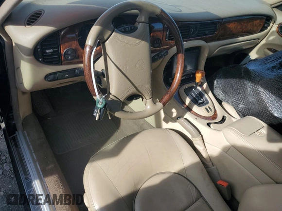1999 Jaguar XJ z VIN SAJKD6043XC872105, wystawiony jako Copart lot #86270724 z przebiegiem Nie podano mil oraz Szkoda całkowita • Salvage title. Historia ofert i sprzedaży dostępna na DreamBid. Obrazek 8.