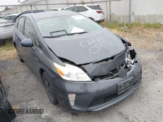 2015 Toyota Prius Four z VIN JTDKN3DUXF1983958, wystawiony jako IAAI lot #42301194 z przebiegiem Nie podano mil oraz . Historia ofert i sprzedaży dostępna na DreamBid. Obrazek 1.