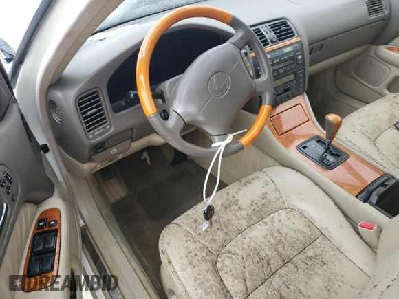 2000 Lexus LS 400 z VIN JT8BH28FXY0178613, wystawiony jako Copart lot #74883444 z przebiegiem Nie podano mil oraz Szkoda całkowita • Salvage title. Historia ofert i sprzedaży dostępna na DreamBid. Obrazek 8.