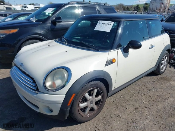 2010 MINI Cooper Hardtop with VIN WMWMF3C59ATZ64568, listed as a IAAI auction lot 41809519 with 104,923 mi miles. Bid and sale history available at carsss.com. Image 2.
