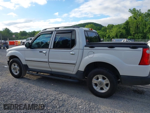 2003 Ford Explorer Sport Trac XLS z VIN 1FMZU77E33UA26042, wystawiony jako IAAI lot #42524905 z przebiegiem 124 878 mil mil oraz . Historia ofert i sprzedaży dostępna na DreamBid. Obrazek 14.