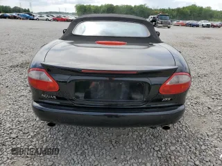 1999 Jaguar XK z VIN SAJGX2044XC031383, wystawiony jako Copart lot #54726925 z przebiegiem 107 696 mil mil oraz Szkody całkowita. Historia ofert i sprzedaży dostępna na DreamBid. Obrazek 6.