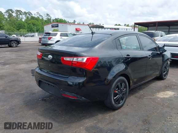 2014 Kia Rio LX with VIN KNADM4A33E6335499, listed as a IAAI auction lot 42123085 with 148,146 mi miles and . Bid and sale history available at DreamBid. Image 4.