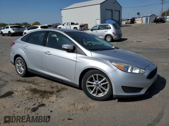 2015 Ford Focus SE with VIN 1FADP3F28FL241020, listed as a Copart auction lot 54559135 with 123,008 mi miles and Salvage title. Bid and sale history available at DreamBid. Image 4.