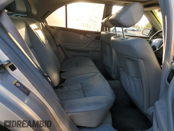 2002 Mercedes-Benz E-Class with VIN WDBJF65J32B496411, listed as a Copart auction lot 75690884 with 128,855 mi miles and Salvage Title. Bid and sale history available at carsss.com. Image 10.