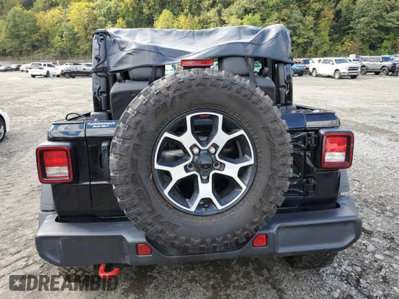 2023 Jeep Wrangler Rubicon with VIN 1C4HJXCGXPW545938, listed as a Copart auction lot 73939634 with 13,590 mi miles and Salvage title. Bid and sale history available at DreamBid. Image 6.
