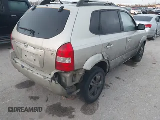 2007 Hyundai Tucson SE with VIN KM8JN12D77U539841, listed as a IAAI auction lot 41777599 with 126,958 mi miles. Bid and sale history available at carsss.com. Image 4.
