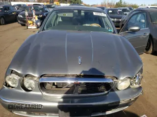 2004 Jaguar XJ with VIN SAJWA71C74SG34056, listed as a Copart auction lot 80083014 with 0 mi miles and Salvage Title. Bid and sale history available at carsss.com. Image 13.
