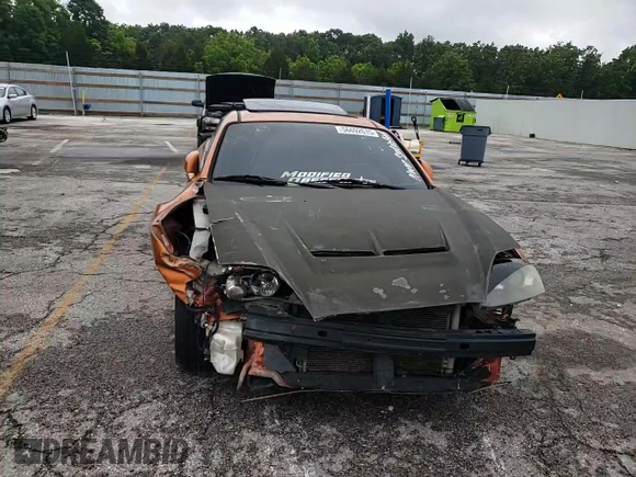 2006 Hyundai Tiburon GT z VIN KMHHN65F66U191134, wystawiony jako Copart lot #56692615 z przebiegiem 197 093 mil mil oraz Szkoda całkowita • Salvage title. Historia ofert i sprzedaży dostępna na DreamBid. Obrazek 14.