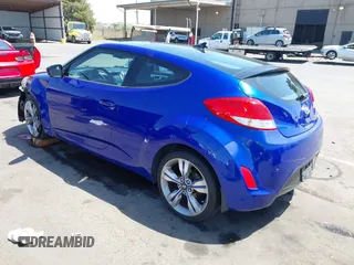 2013 Hyundai Veloster w/Black Int with VIN KMHTC6AD6DU143974, listed as a IAAI auction lot 42164745 with 136,195 mi miles and . Bid and sale history available at DreamBid. Image 3.