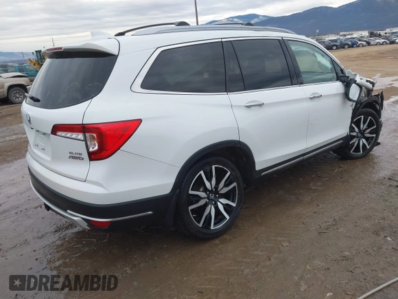 2021 Honda Pilot Elite with VIN 5FNYF6H03MB044154, listed as a IAAI auction lot 41050202 with 60,331 mi miles and . Bid and sale history available at DreamBid. Image 4.
