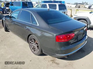 2011 Audi A8 with VIN WAURVAFD9BN014362, listed as a IAAI auction lot 41960366 with 135,244 mi miles and . Bid and sale history available at DreamBid. Image 3.