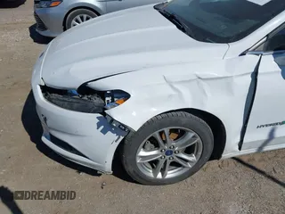 2016 Ford Fusion SE Hybrid with VIN 3FA6P0LU1GR127280, listed as a IAAI auction lot 41754682 with 194,357 mi miles. Bid and sale history available at carsss.com. Image 6.