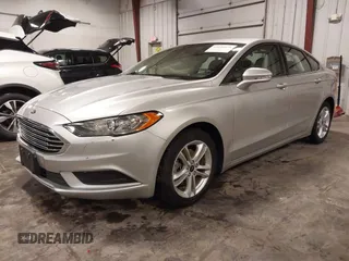 2018 Ford Fusion SE with VIN 3FA6P0HD1JR243112, listed as a IAAI auction lot 42256676 with 112,003 mi miles and . Bid and sale history available at DreamBid. Image 2.