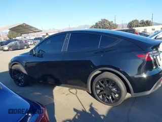2024 Tesla Model Y Long Range with VIN 7SAYGDEEXRA216186, listed as a IAAI auction lot 41106653 with 25,331 mi miles and . Bid and sale history available at DreamBid. Image 14.