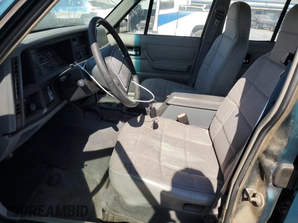 1996 Jeep Cherokee Sport with VIN 1J4FJ68S3TL257912, listed as a Copart auction lot 77109634 with 53,841 mi miles and Clean Title. Bid and sale history available at carsss.com. Image 7.