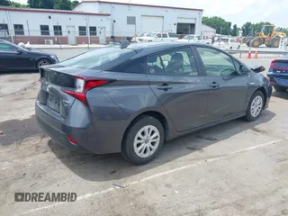 2021 Toyota Prius L Eco z VIN JTDKAMFU3M3152785, wystawiony jako IAAI lot #42501351 z przebiegiem 60 489 mil mil oraz . Historia ofert i sprzedaży dostępna na DreamBid. Obrazek 4.