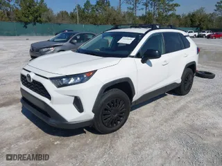 2020 Toyota RAV4 LE with VIN JTMH1RFV0LD060963, listed as a IAAI auction lot 41634608 with 90,881 mi miles. Bid and sale history available at carsss.com. Image 2.