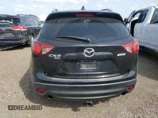 2015 Mazda CX-5 Grand Touring with VIN JM3KE4DY9F0516357, listed as a Copart auction lot 53156215 with 118,621 mi miles and Salvage Title. Bid and sale history available at DreamBid. Image 6.