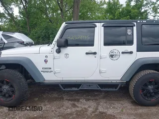 2014 Jeep Wrangler Unlimited Sport with VIN 1C4BJWDG9EL135077, listed as a IAAI auction lot 42324775 with 104,221 mi miles and . Bid and sale history available at DreamBid. Image 14.