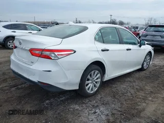 2020 Toyota Camry LE with VIN 4T1C11AK9LU912585, listed as a IAAI auction lot 41711816 with 142,751 mi miles. Bid and sale history available at carsss.com. Image 4.