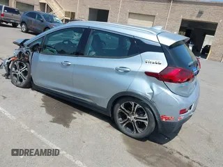 2017 Chevrolet Bolt EV Premier z VIN 1G1FX6S05H4141097, wystawiony jako IAAI lot #42164351 z przebiegiem 93 210 mil mil oraz . Historia ofert i sprzedaży dostępna na DreamBid. Obrazek 3.