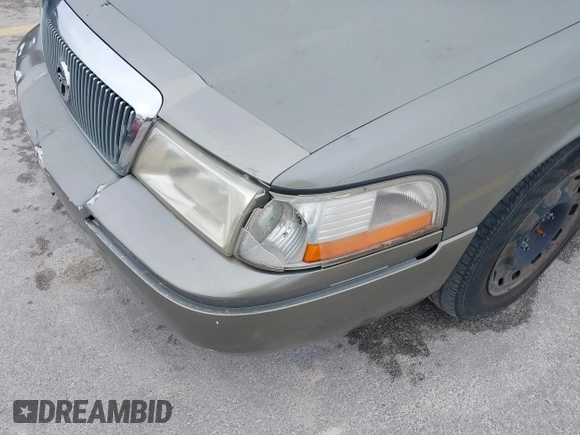 2003 Mercury Grand Marquis GS Convenience z VIN 2MEFM74W83X678151, wystawiony jako IAAI lot #42393410 z przebiegiem 273 966 mil mil oraz . Historia ofert i sprzedaży dostępna na DreamBid. Obrazek 13.