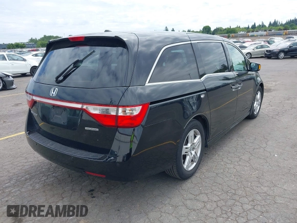 2012 Honda Odyssey Touring with VIN 5FNRL5H93CB121190, listed as a IAAI auction lot 42223998 with 154,358 mi miles and . Bid and sale history available at DreamBid. Image 4.