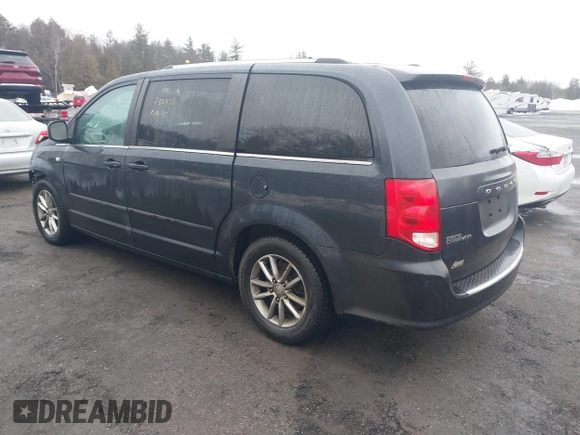 2014 Dodge Grand Caravan SXT with VIN 2C4RDGCG2ER463395, listed as a IAAI auction lot 41709948 with 137,783 mi miles and . Bid and sale history available at DreamBid. Image 3.