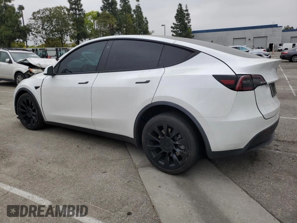 2021 Tesla Model Y Long Range with VIN 5YJYGDEE3MF214823, listed as a Copart auction lot 50738045 with 63,227 mi miles and Salvage Title. Bid and sale history available at DreamBid. Image 2.