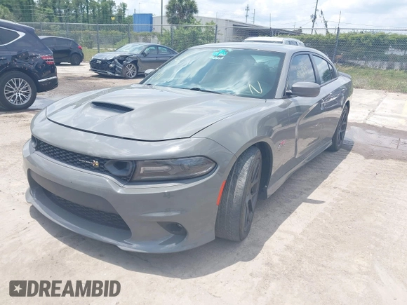 2019 Dodge Charger Scat Pack with VIN 2C3CDXGJ2KH633854, listed as a IAAI auction lot 42212517 with 74,285 mi miles and . Bid and sale history available at DreamBid. Image 2.