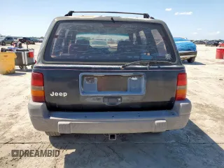 1995 Jeep Grand Cherokee Laredo z VIN 1J4FX58S9SC534442, wystawiony jako Copart lot #61233725 z przebiegiem 363 688 mil mil oraz Szkoda całkowita • Salvage title. Historia ofert i sprzedaży dostępna na DreamBid. Obrazek 6.