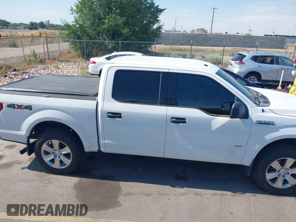 2015 Ford F-150 XLT with VIN 1FTEW1EP3FFC97920, listed as a IAAI auction lot 42619389 with 151,762 mi miles and . Bid and sale history available at DreamBid. Image 13.