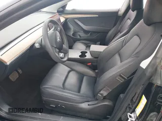 2023 Tesla Model 3 with VIN 5YJ3E1EA5PF647737, listed as a IAAI auction lot 42430145 with 20,525 mi miles and . Bid and sale history available at DreamBid. Image 5.