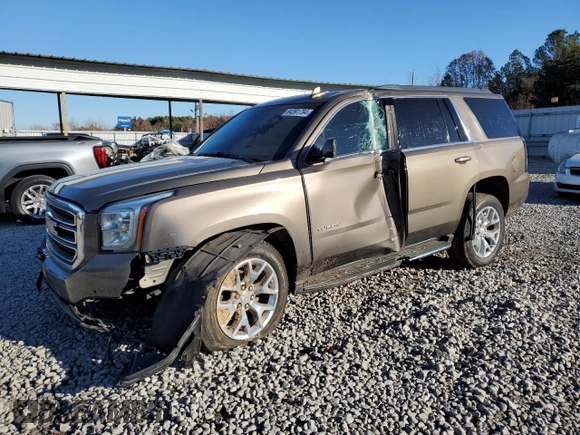2015 GMC Yukon SLT with VIN 1GKS1BKC8FR664001, listed as a Copart auction lot 84391784 with 0 mi miles and Salvage Title. Bid and sale history available at carsss.com. Image 1.