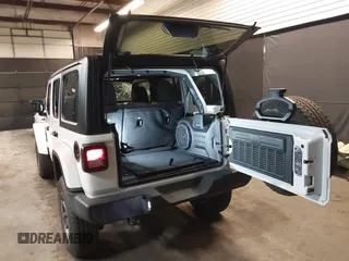 2021 Jeep Wrangler Unlimited Freedom with VIN 1C4HJXDNXMW681267, listed as a IAAI auction lot 42026181 with 40,143 mi miles and . Bid and sale history available at DreamBid. Image 3.