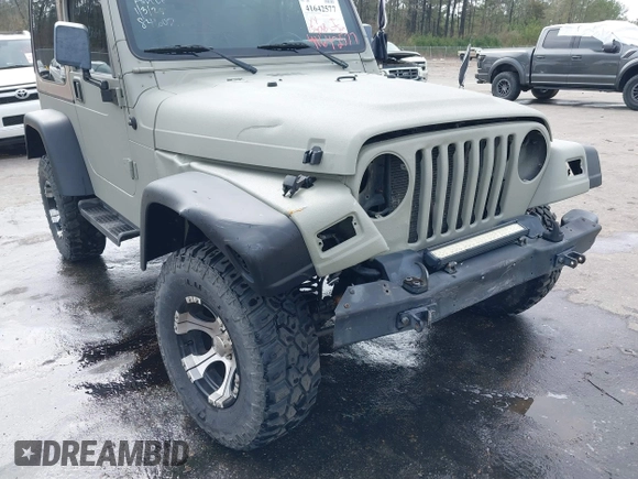 1999 Jeep Wrangler Sahara with VIN 1J4FY49S0XP480017, listed as a IAAI auction lot 41642577 with 154,068 mi miles. Bid and sale history available at carsss.com. Image 6.