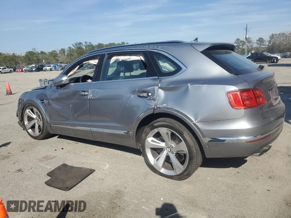 2019 Bentley Bentayga V8 z VIN SJAAM2ZV9KC024755, wystawiony jako Copart lot #46757605 z przebiegiem 26 951 mil mil oraz Szkoda całkowita • Salvage title. Historia ofert i sprzedaży dostępna na DreamBid. Obrazek 2.
