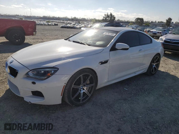 2014 BMW M6 z VIN WBSLX9C51ED160143, wystawiony jako Copart lot #50762185 z przebiegiem 91 718 mil mil oraz Szkody całkowita. Historia ofert i sprzedaży dostępna na DreamBid. Obrazek 1.