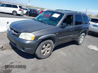 2003 Mazda Tribute ES with VIN 4F2CZ96113KM52877, listed as a IAAI auction lot 42217251 with 218,475 mi miles and . Bid and sale history available at DreamBid. Image 2.