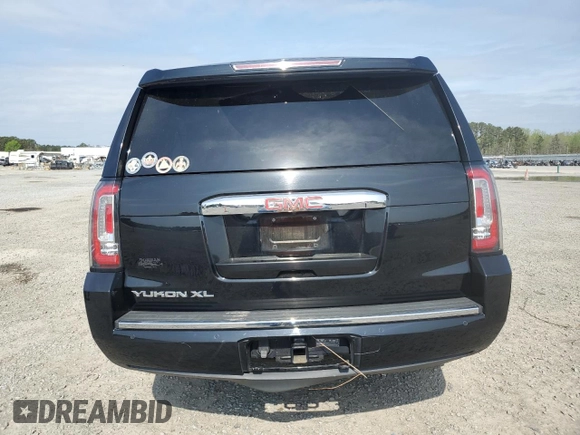 2015 GMC Yukon XL Denali with VIN 1GKS2JKJ5FR243343, listed as a Copart auction lot 51352125 with 142,996 mi miles and Salvage Title. Bid and sale history available at DreamBid. Image 6.